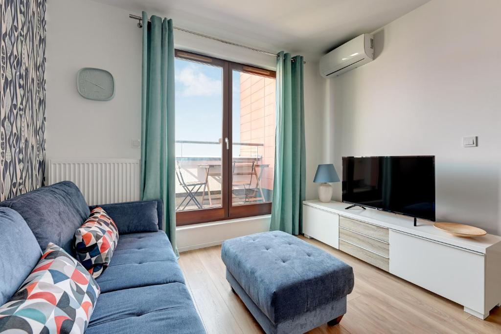 Televízia a/alebo spoločenská miestnosť v ubytovaní GRANO FLATS Gdańsk - Chmielna 73
