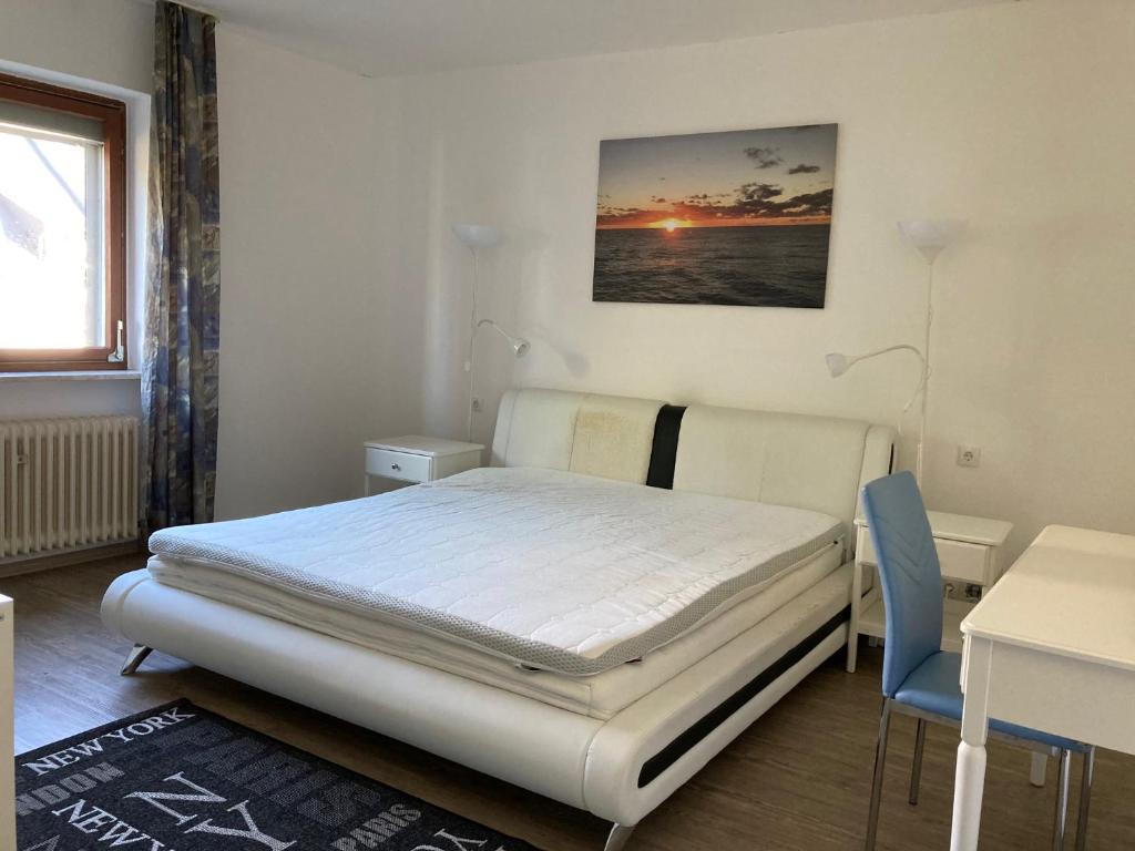 Un pat sau paturi într-o cameră la Ferienwohnung Brenderweg