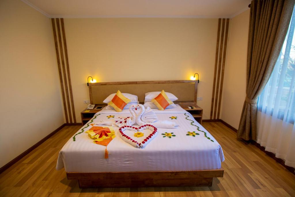 Postel nebo postele na pokoji v ubytování Acacia Hotel Bagan