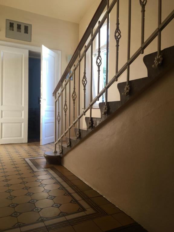 a hallway with a stairway with a door and a stair at Apartments Katrca Ljubljana in Ljubljana