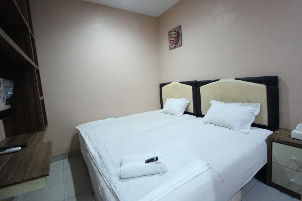 Postel nebo postele na pokoji v ubytování O2 Residence