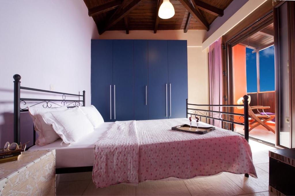 Postel nebo postele na pokoji v ubytování Tajo VIllas