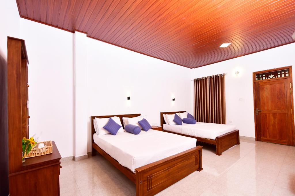Postel nebo postele na pokoji v ubytování Ariya Rest & Ayurveda spa