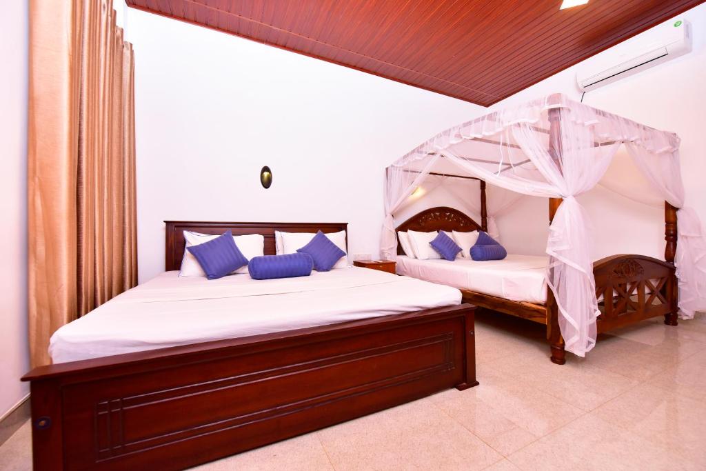 Postel nebo postele na pokoji v ubytování Ariya Rest & Ayurveda spa