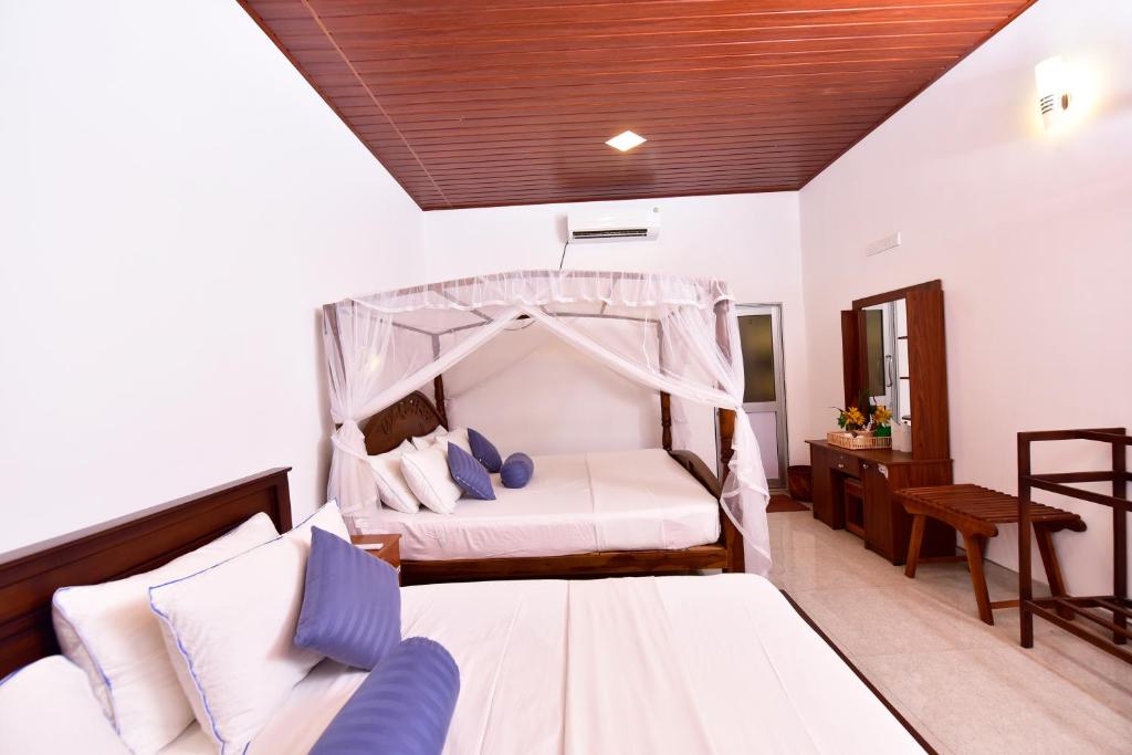 Postel nebo postele na pokoji v ubytování Ariya Rest & Ayurveda spa