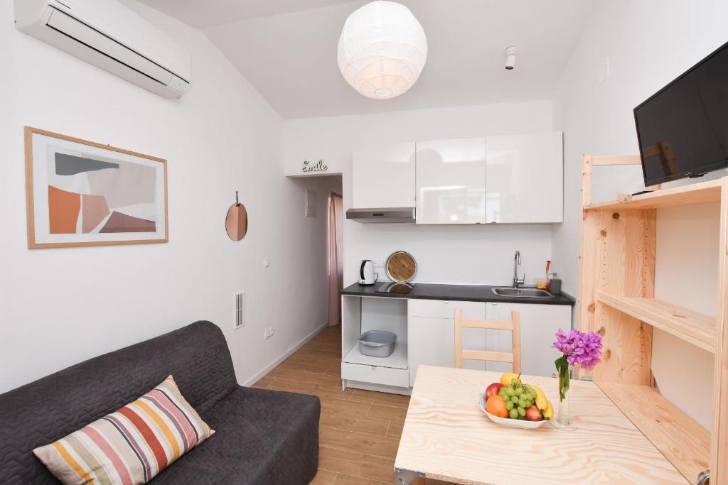 Kuchyň nebo kuchyňský kout v ubytování Apartments Nina
