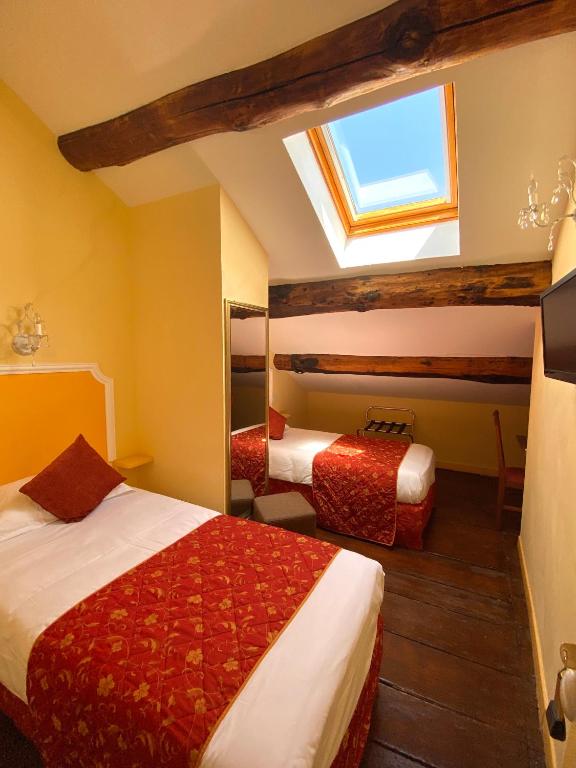 Postel nebo postele na pokoji v ubytování Hôtel U Palazzu & Spa