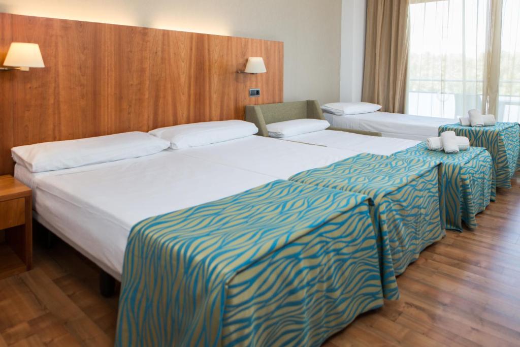 Postel nebo postele na pokoji v ubytování RVHotels Nautic Park