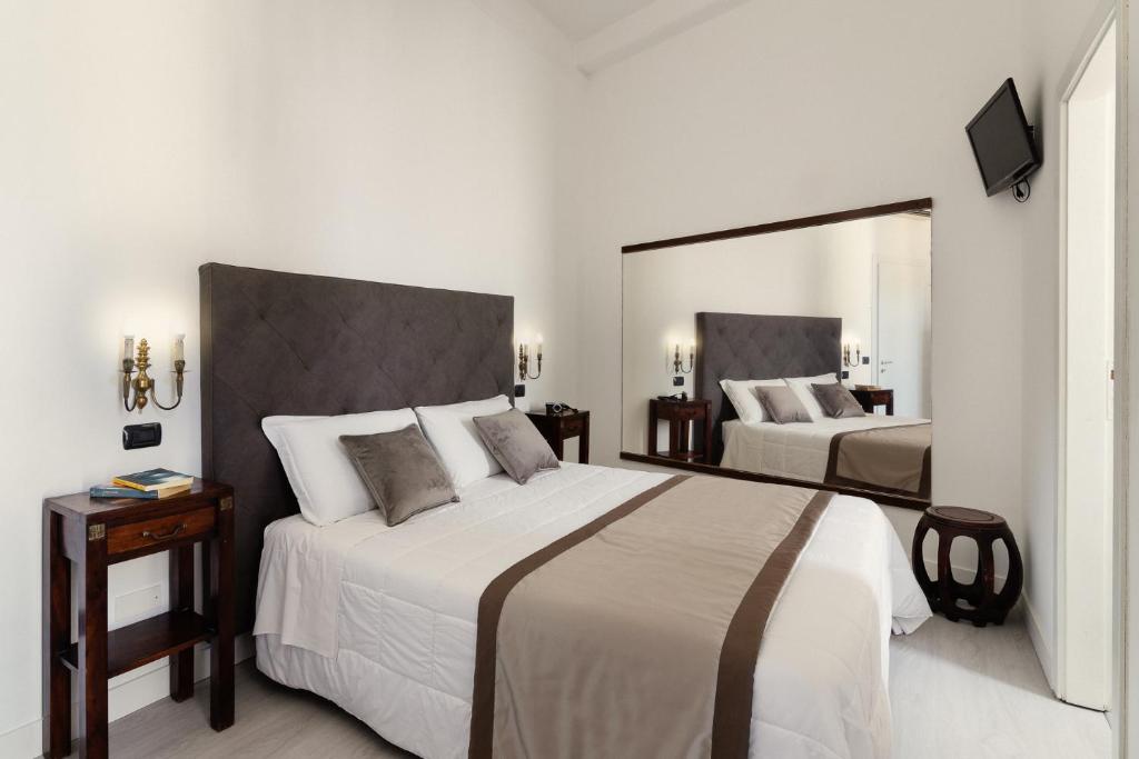 Postel nebo postele na pokoji v ubytování Hotel Berna