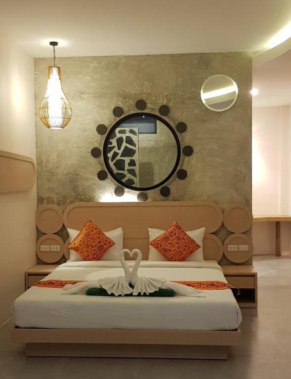 Postel nebo postele na pokoji v ubytování Khaolak Yama Resort - SHA Plus