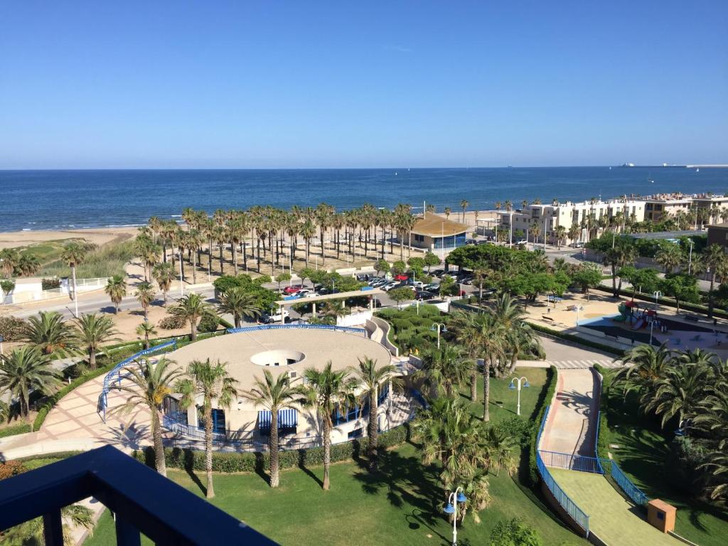 a view of the beach from the balcony of a resort at ApartUP Patacona Essence in Valencia