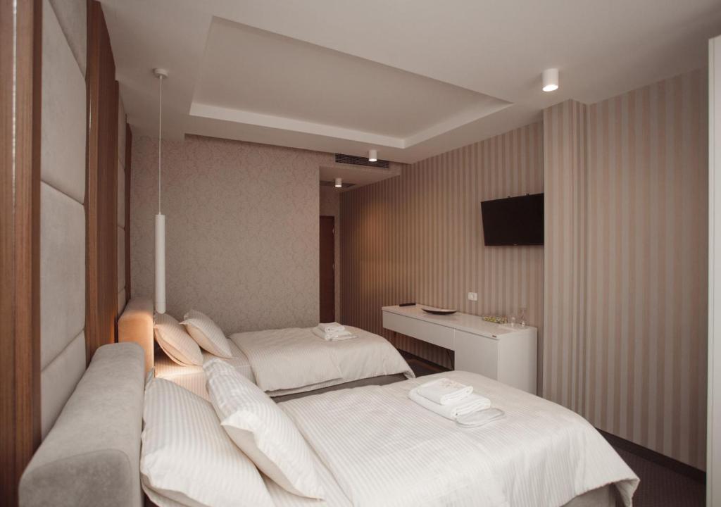 Postel nebo postele na pokoji v ubytování Hotel Chicago