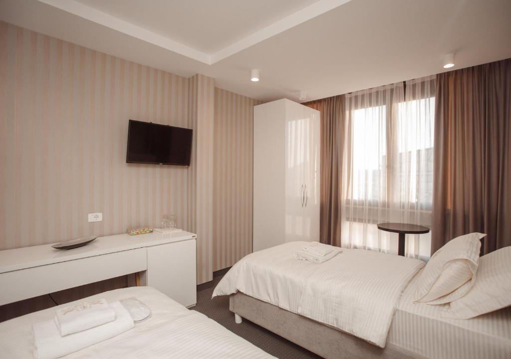 Postel nebo postele na pokoji v ubytování Hotel Chicago