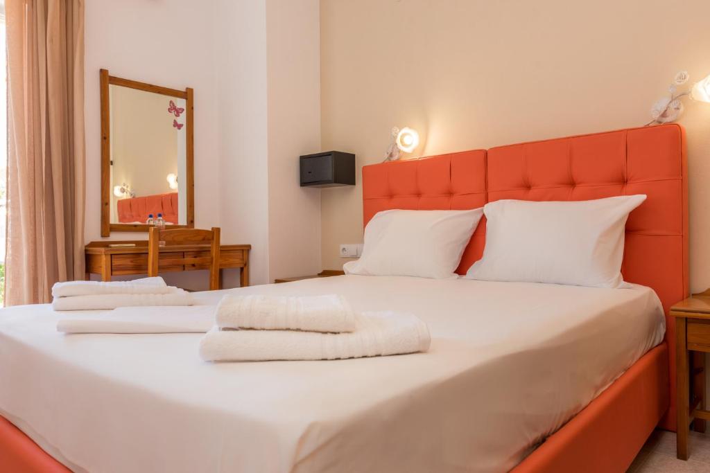 Posteľ alebo postele v izbe v ubytovaní Nikos Rooms