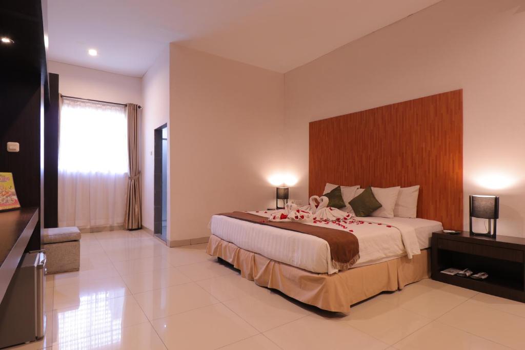 Postel nebo postele na pokoji v ubytování Saka Hotel Medan