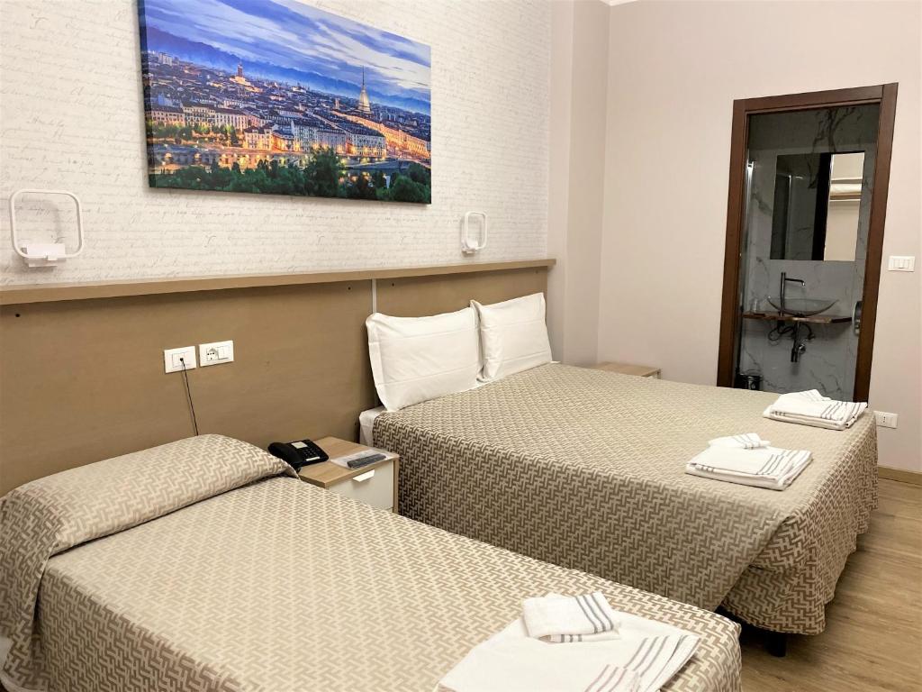 Postel nebo postele na pokoji v ubytování Hotel Lo Scudiero
