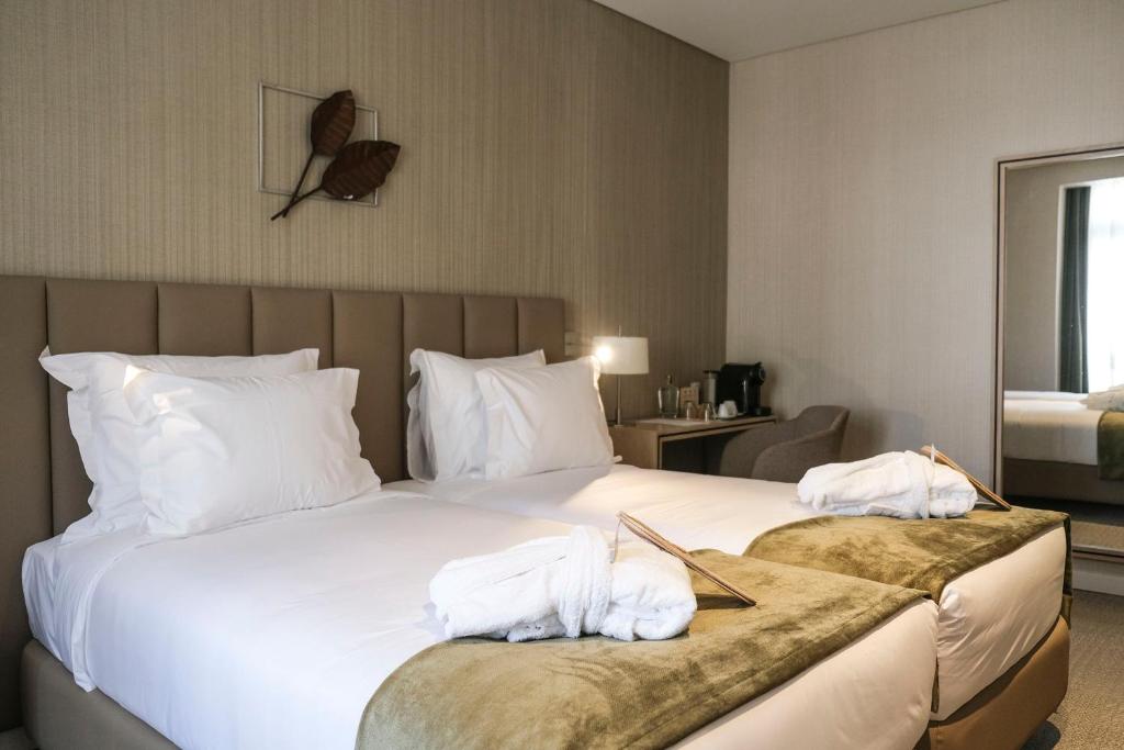 Ένα ή περισσότερα κρεβάτια σε δωμάτιο στο The Leaf Boutique Hotel Lisbon - Adults Only