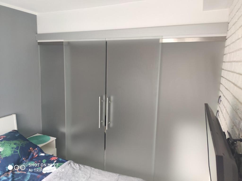 Posteľ alebo postele v izbe v ubytovaní Apartament Tygrys