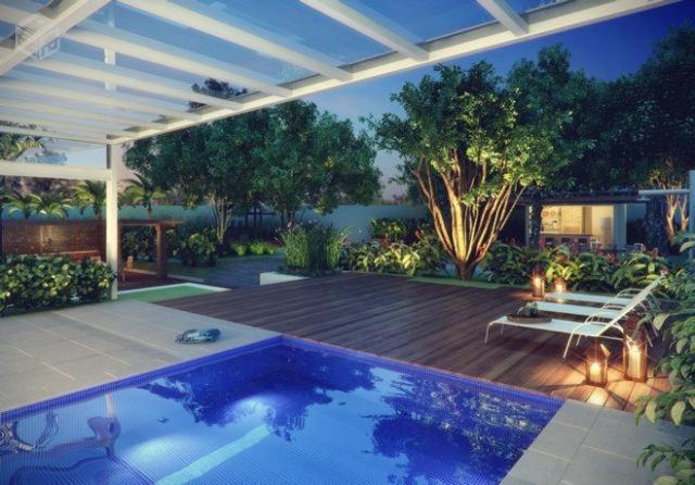 a backyard with a swimming pool and a patio with a deck at Dot Home Guanabara - Lindo Apartamento Mobiliado em Campinas in Campinas