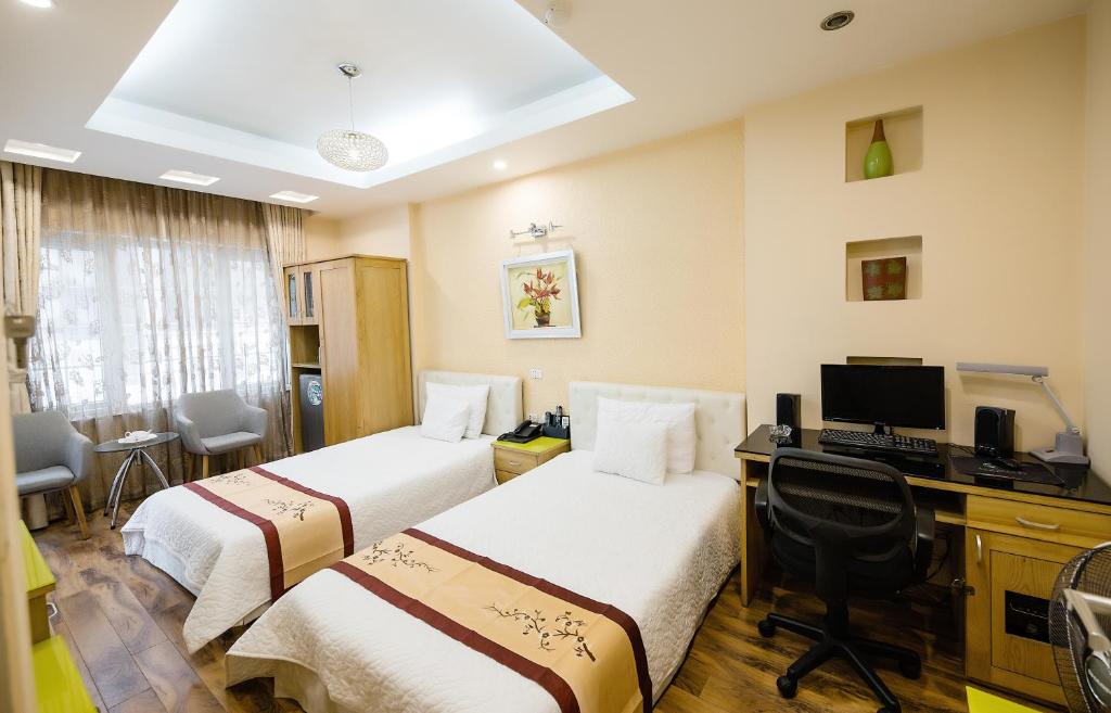 Postel nebo postele na pokoji v ubytování Sunny Hotel