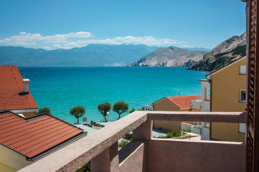 a view of the ocean from the balcony of a building at Apartment Casa Di Nono in Baška
