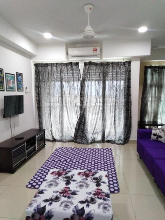 Postel nebo postele na pokoji v ubytování Ziehass Homestay D'Perdana Apartment