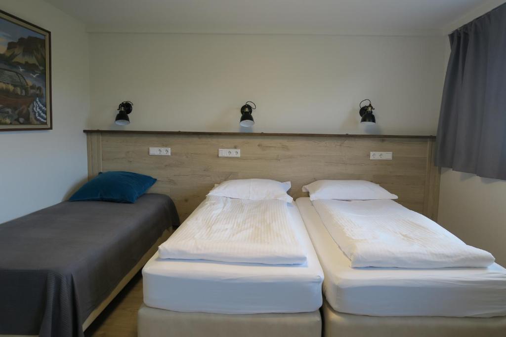 Postel nebo postele na pokoji v ubytování Dilksnes Guesthouse