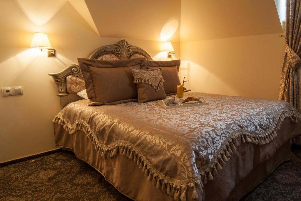 Postel nebo postele na pokoji v ubytování Hotel Stil