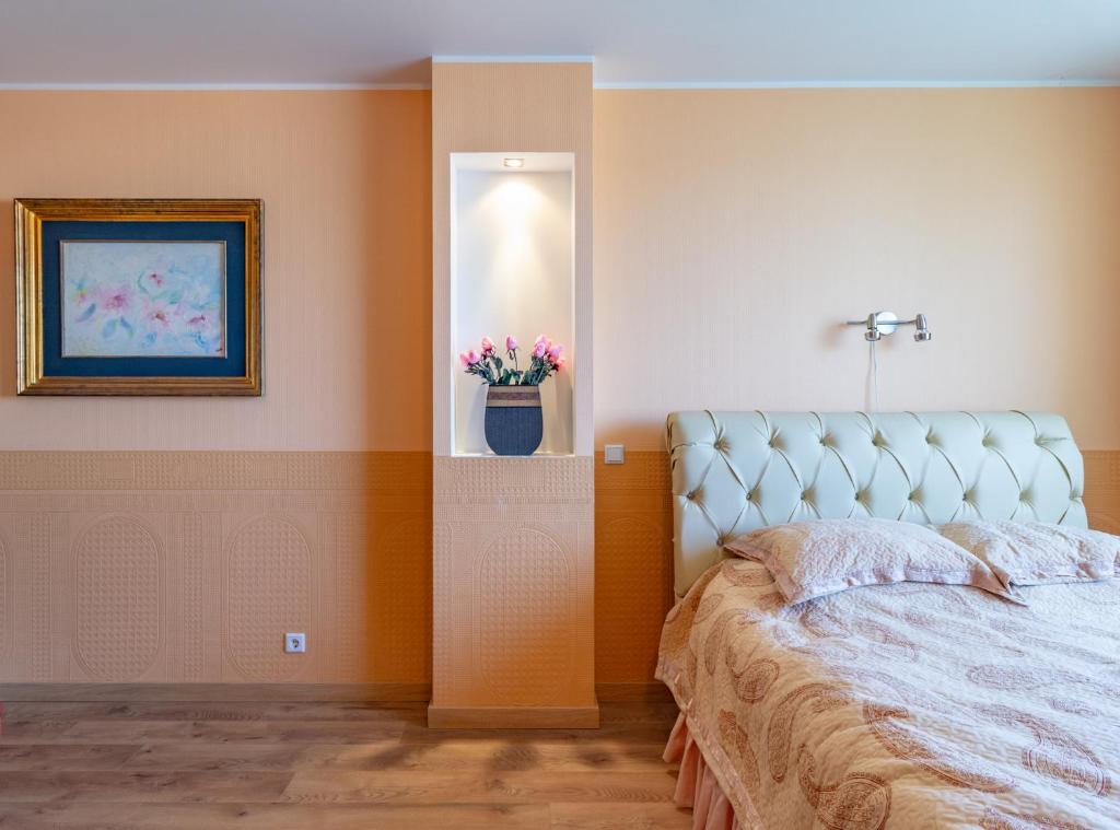 Postel nebo postele na pokoji v ubytování Fortuna Apartments