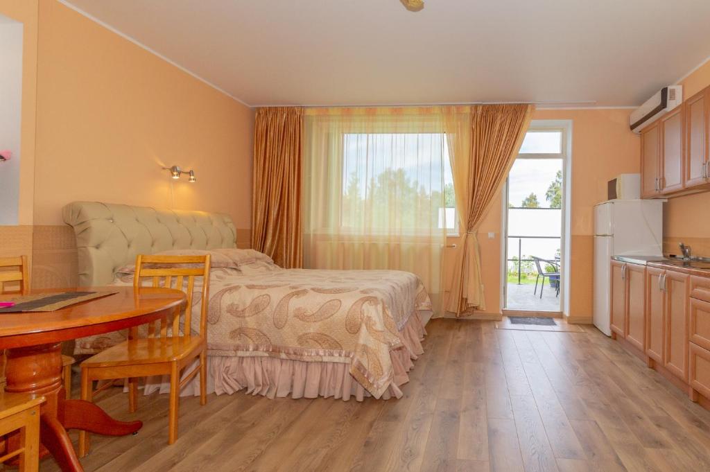 Postel nebo postele na pokoji v ubytování Fortuna Apartments