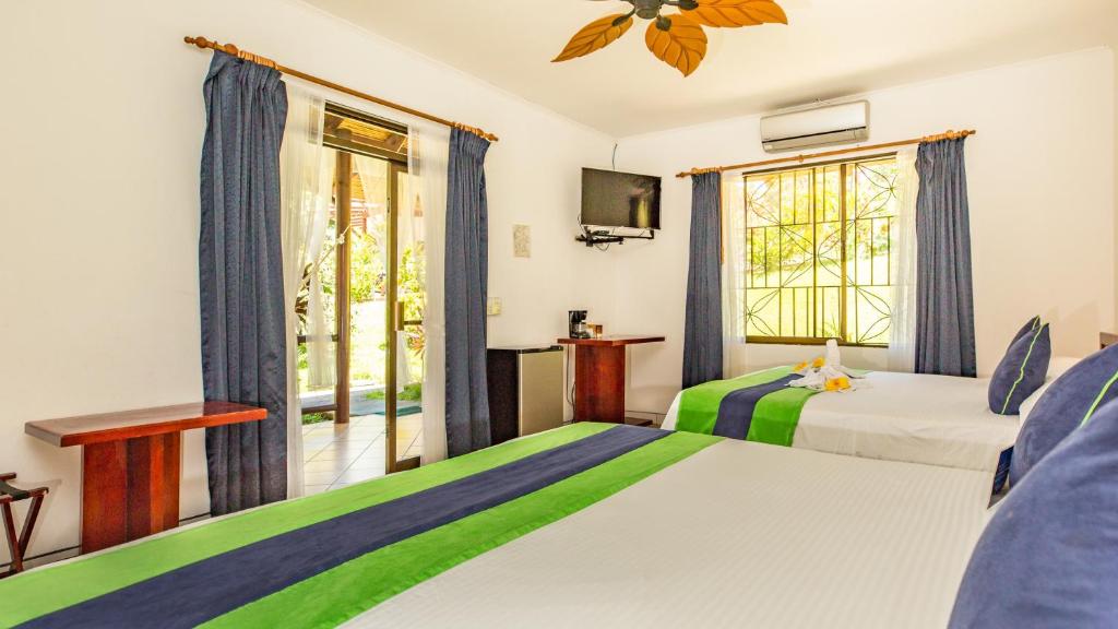 Postel nebo postele na pokoji v ubytování Hotel Villas Rio Mar
