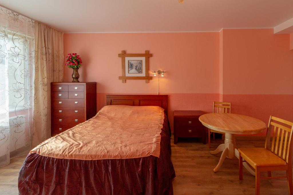 Postel nebo postele na pokoji v ubytování Fortuna Apartments