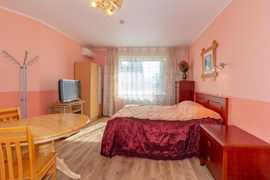 Postel nebo postele na pokoji v ubytování Fortuna Apartments