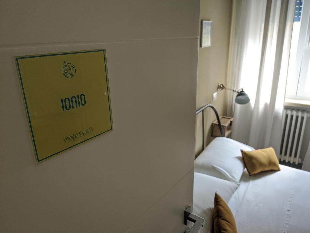 Postel nebo postele na pokoji v ubytování Terra di Sud Rooms