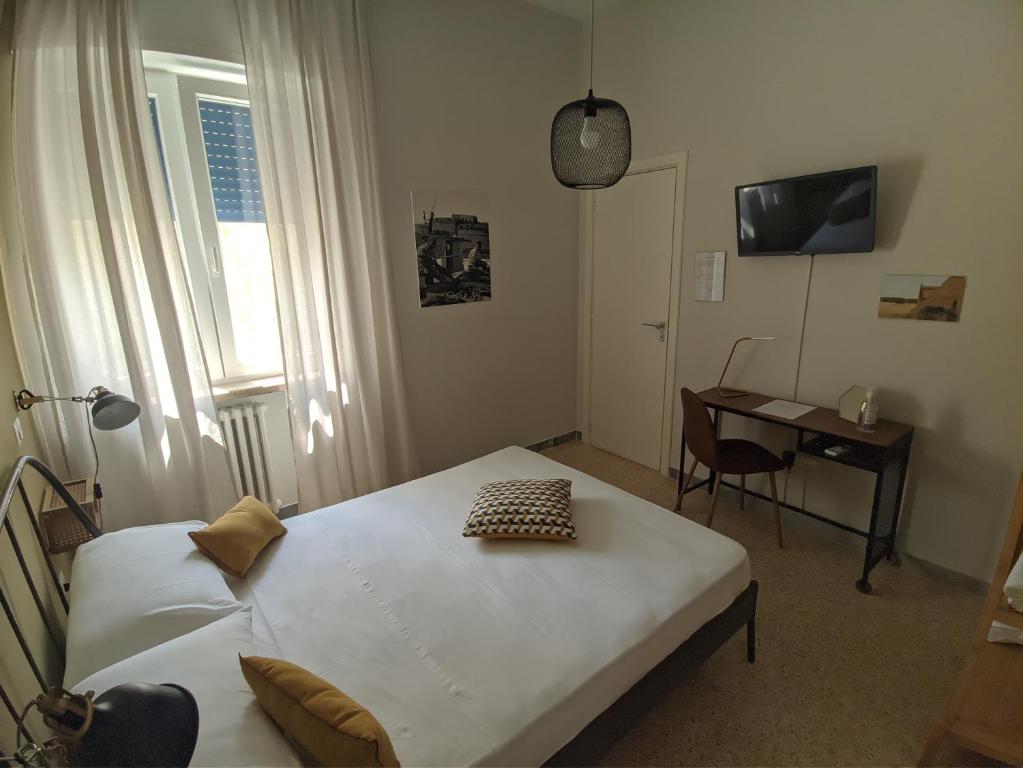 Postel nebo postele na pokoji v ubytování Terra di Sud Rooms