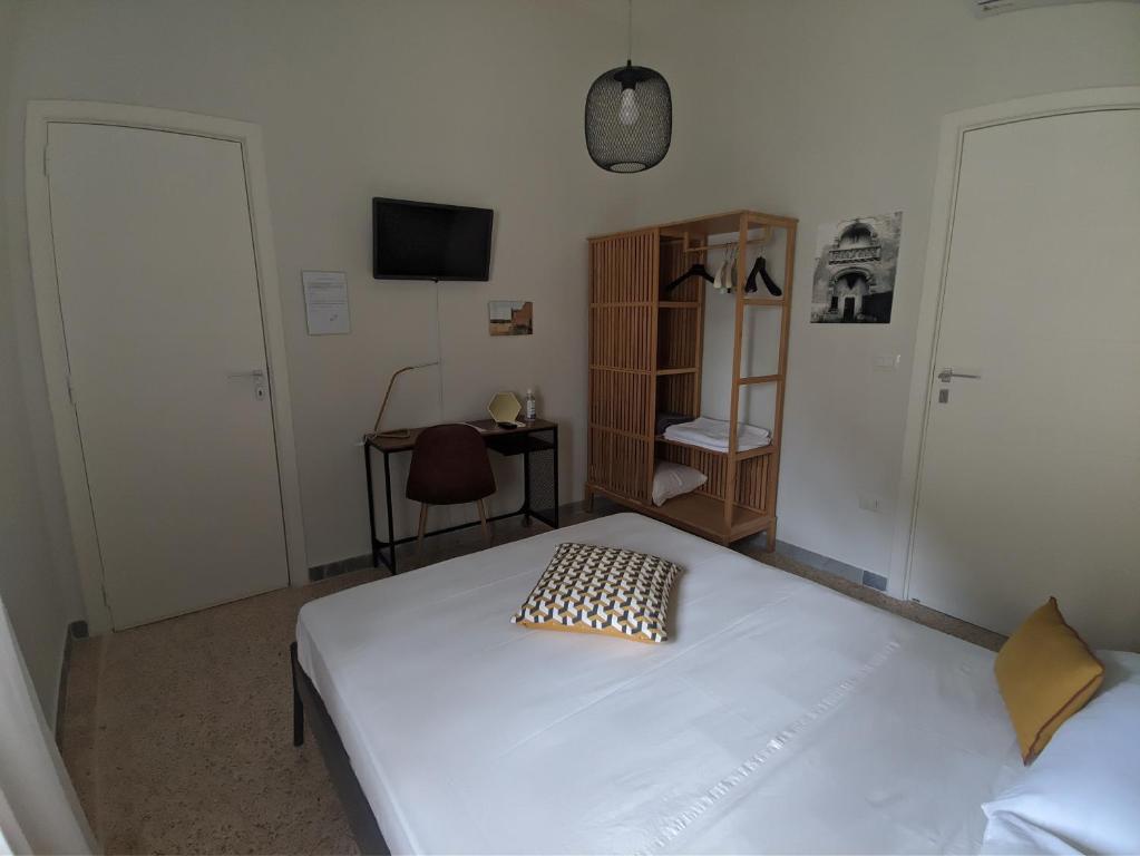 Postel nebo postele na pokoji v ubytování Terra di Sud Rooms