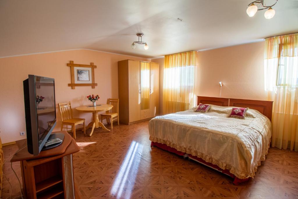 Postel nebo postele na pokoji v ubytování Fortuna Apartments