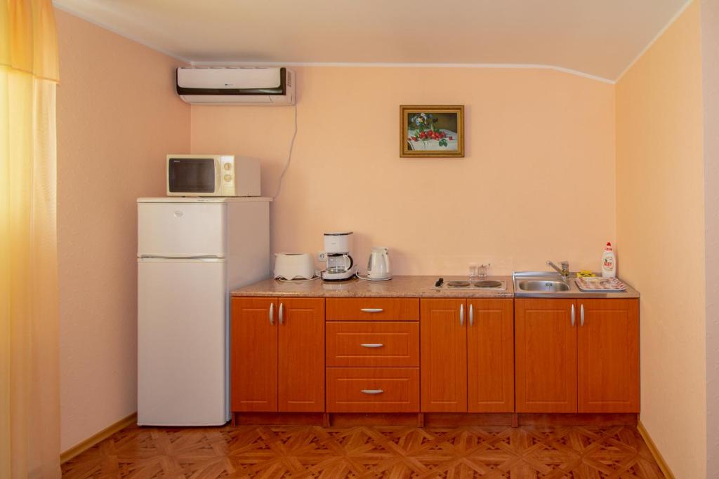 Kuchyň nebo kuchyňský kout v ubytování Fortuna Apartments