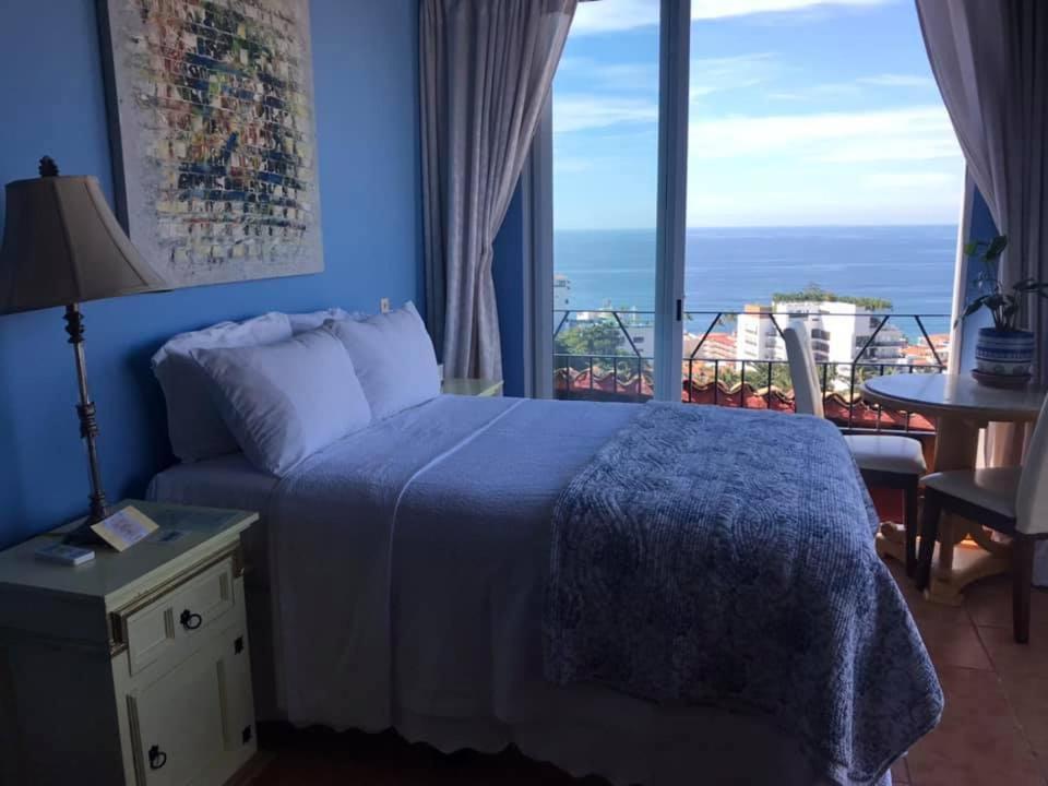 A bed or beds in a room at Casa Isabel a Boutique Hilltop Inn