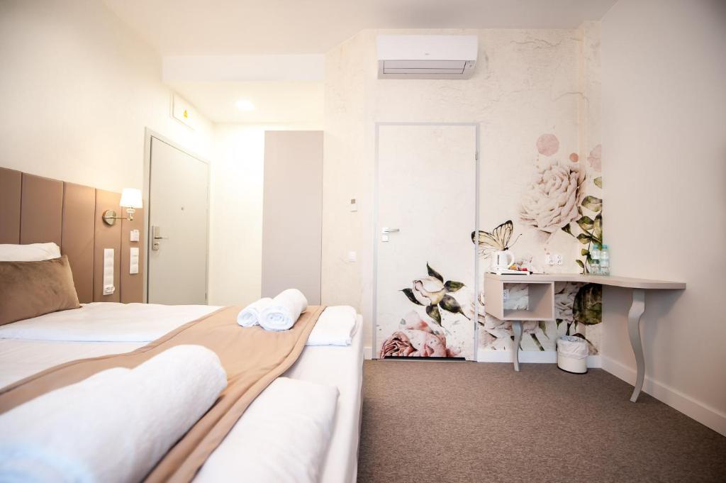 Postel nebo postele na pokoji v ubytování Hotel Gdynia Boutique
