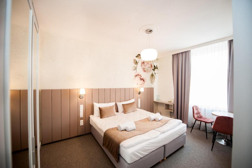 Postel nebo postele na pokoji v ubytování Hotel Gdynia Boutique