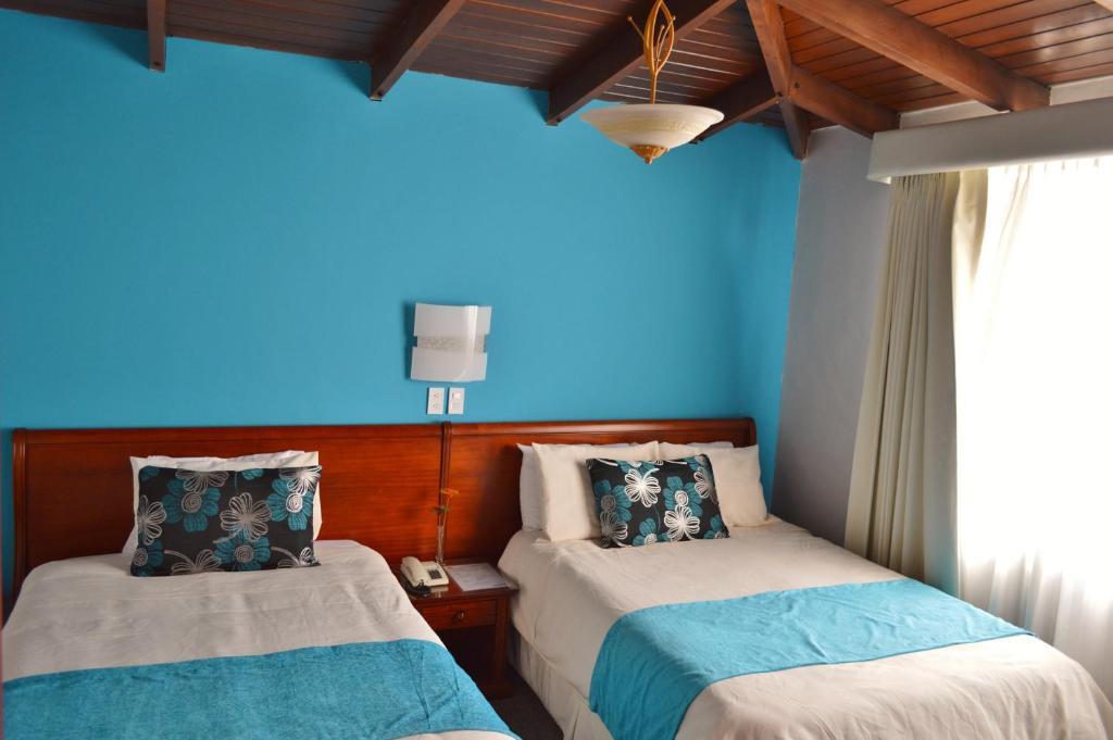 Postel nebo postele na pokoji v ubytování La Carolina Inn