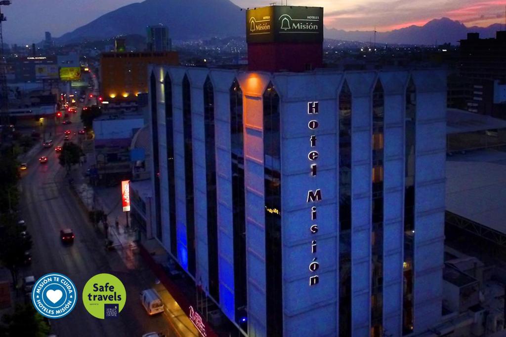 a building with a sign on the side of it at Mision Monterrey Centro Historico in Monterrey