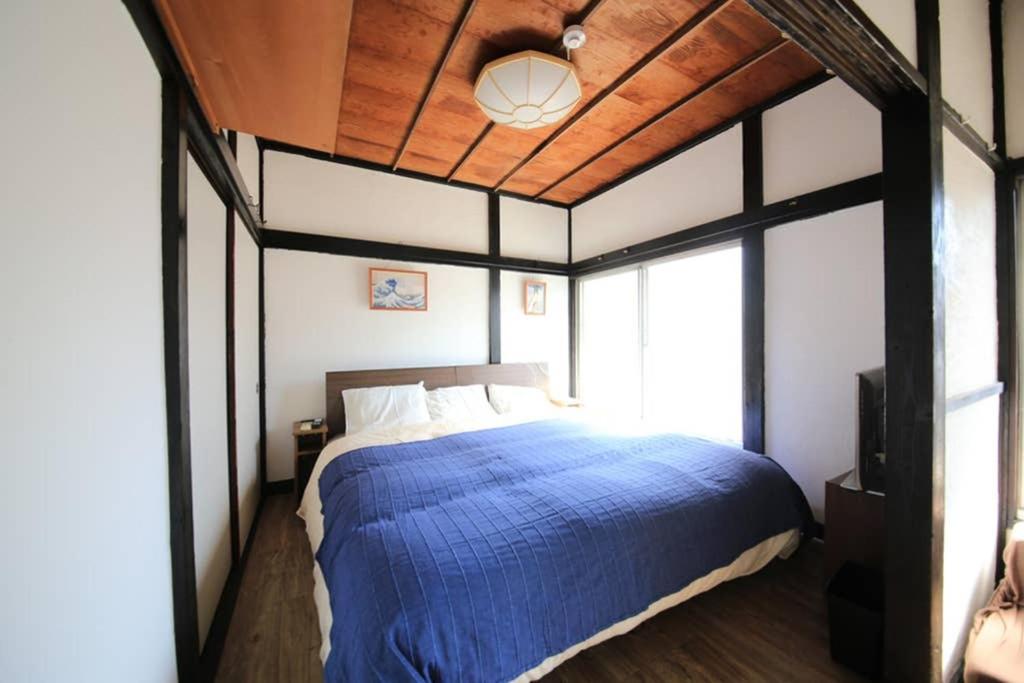 Кровать или кровати в номере 押上シエルロッジ