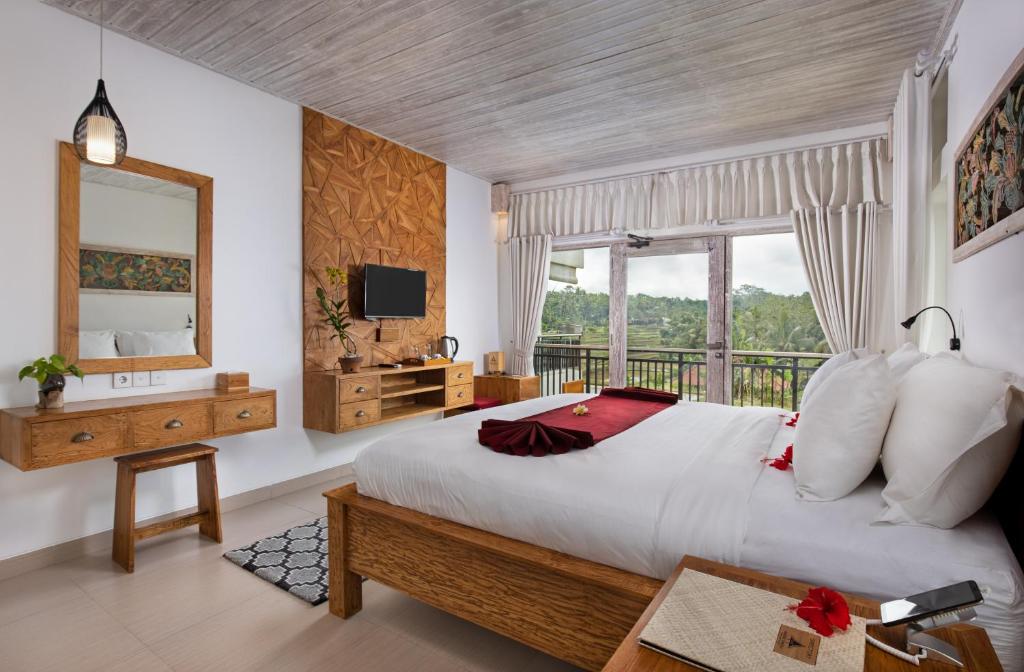 Postel nebo postele na pokoji v ubytování Abian Taksu Suite & Villas