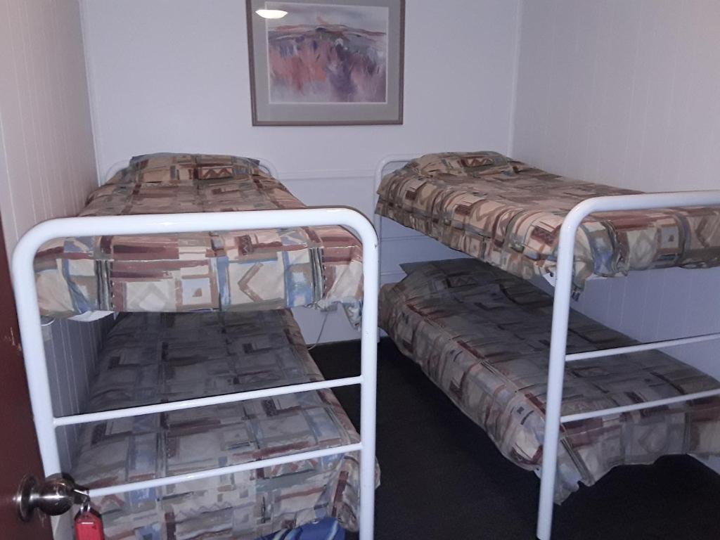 Postel nebo postele na pokoji v ubytování Snowdream Motel