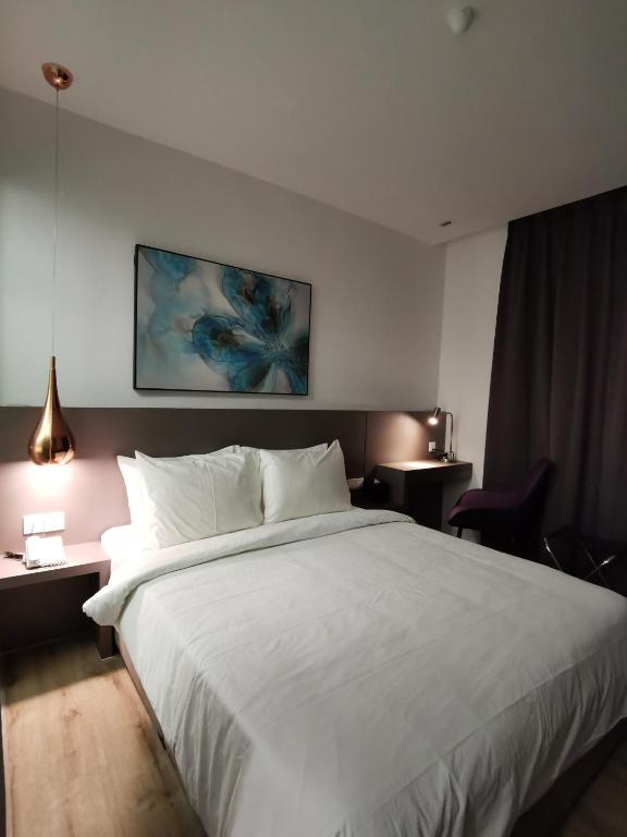 Postel nebo postele na pokoji v ubytování Otel Hotel Sibu