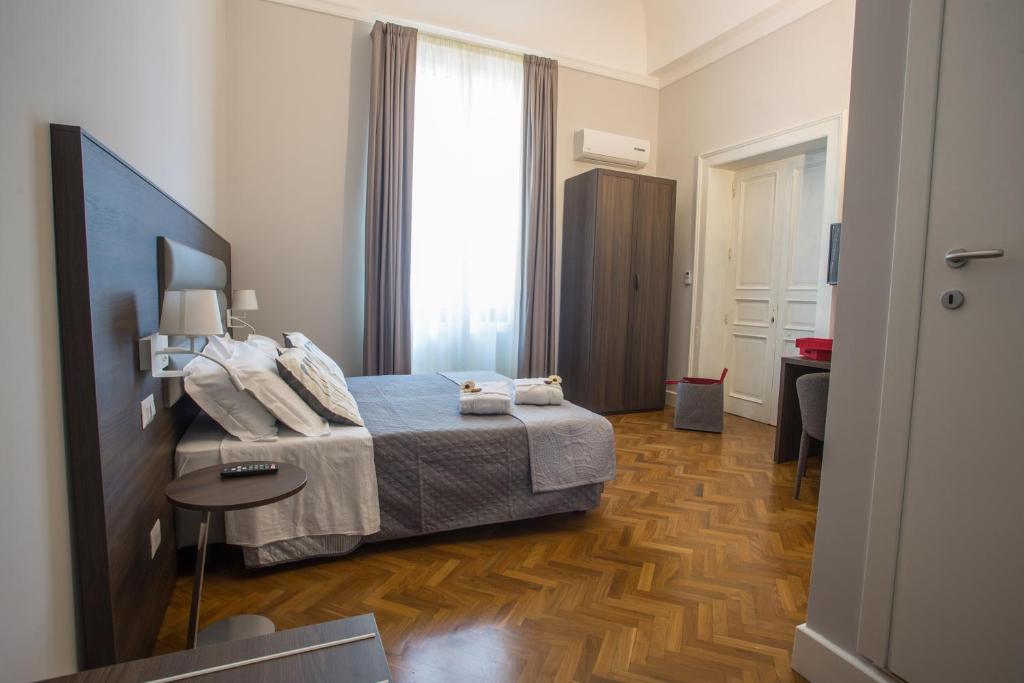 Postel nebo postele na pokoji v ubytování Re Vittorio De Luxe