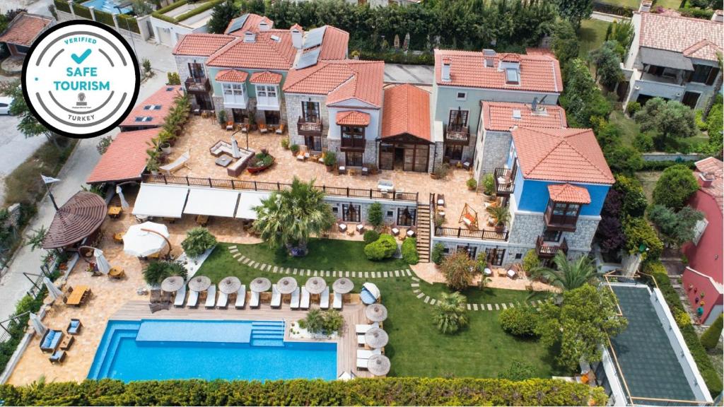 an aerial view of a house with a swimming pool at Alacati Kapari Hotel - Special Category in Alaçatı