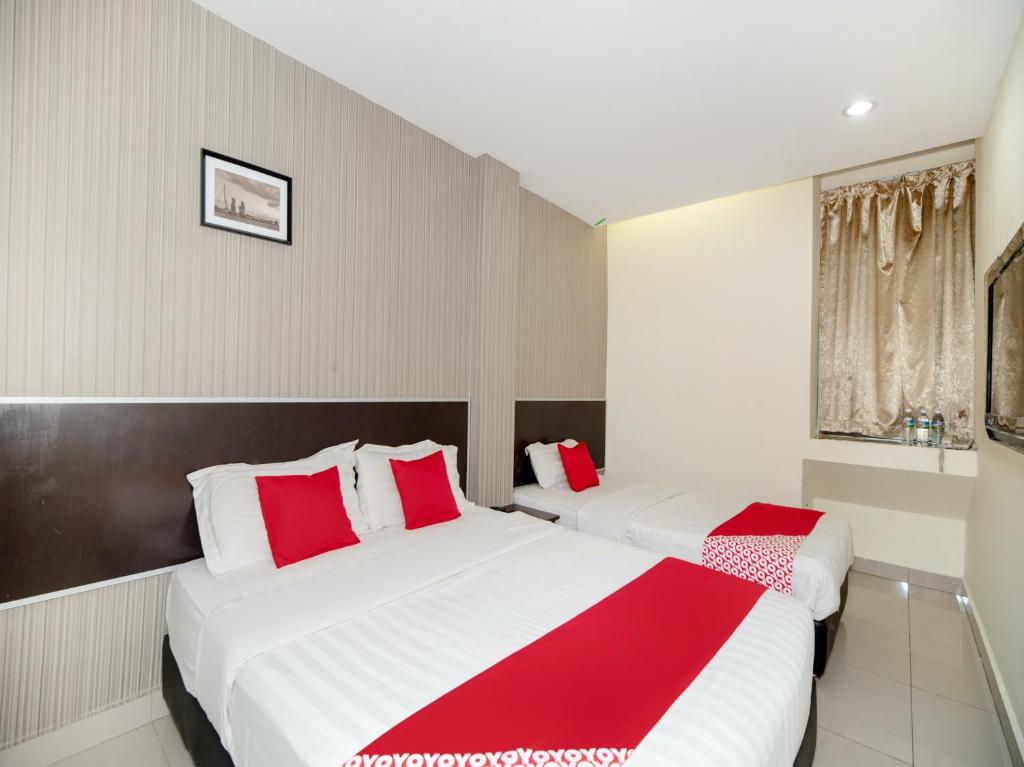 En eller flere senge i et værelse på Super OYO 89965 Stay Inn Ii